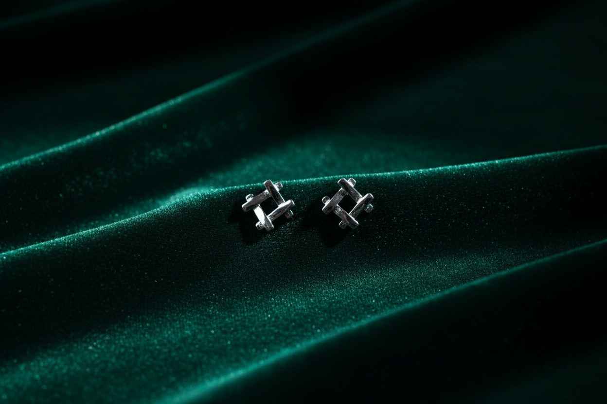 Silver 925 geometric earrings on dark green velvet