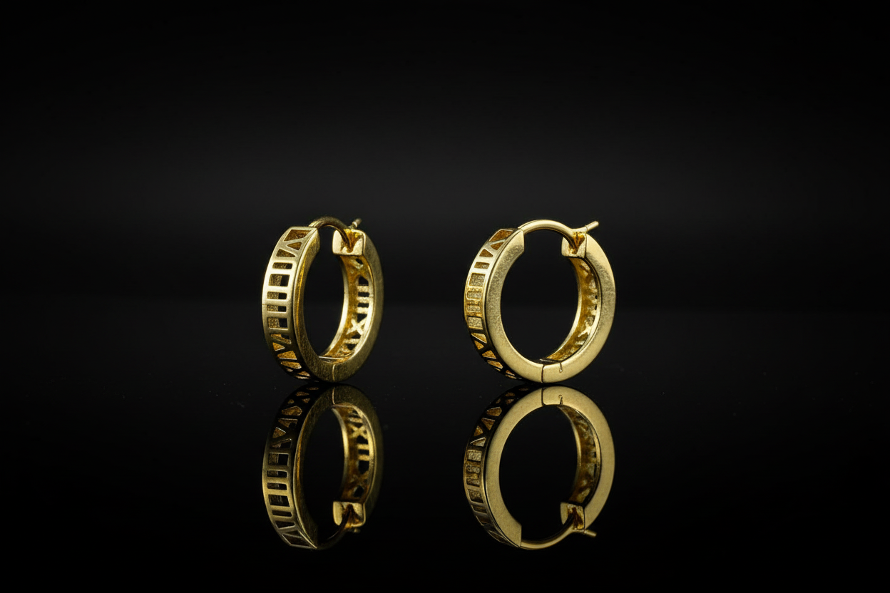 Dramatic shot of 925 silver gold polished Roman numeral hoop earrings